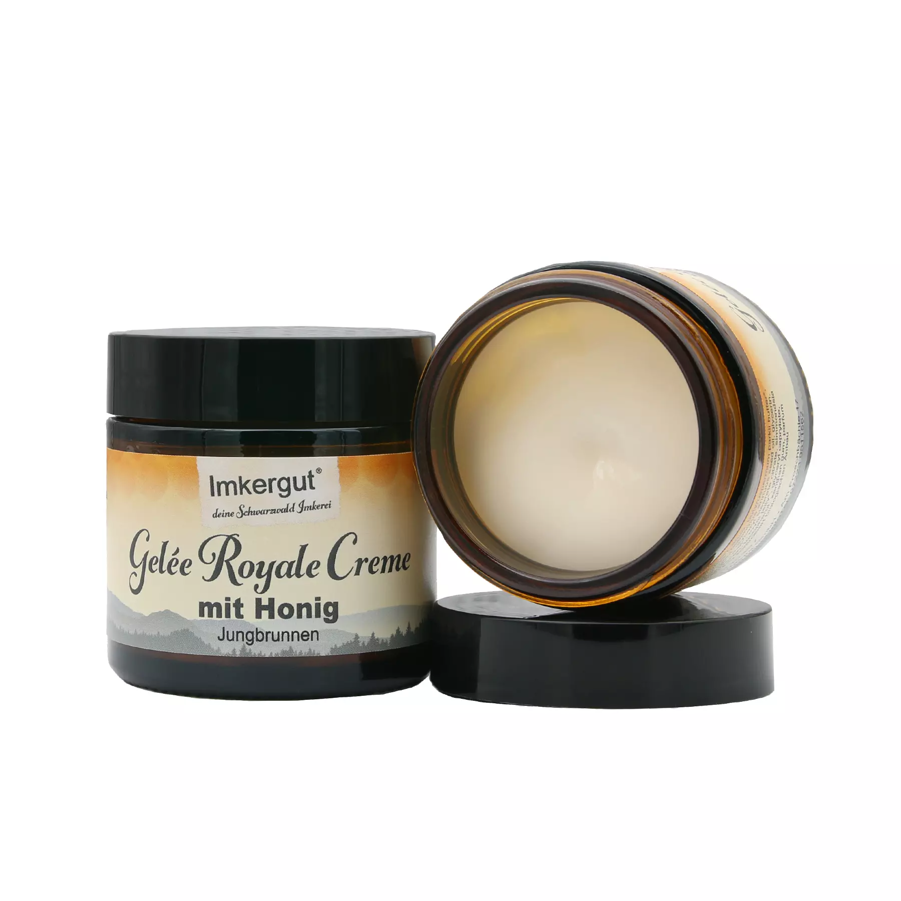 Gelee Royale Creme geöffnet liegend neben geschlossener Gelee Royale Creme mit neuem Etikett